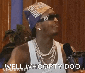 Man In Sunglasses And Bandana Talking Into Microphone GIF
