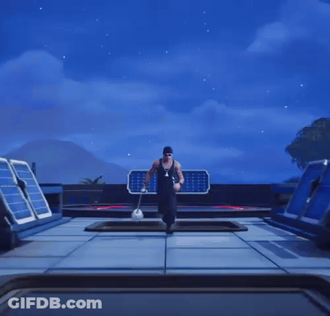 Man In Sunglasses And Beanie Holding Gun GIF