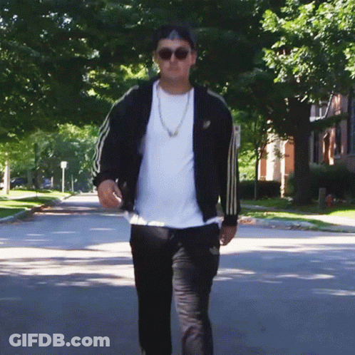 Man In Sunglasses And Black Adidas Jacket Walking GIF