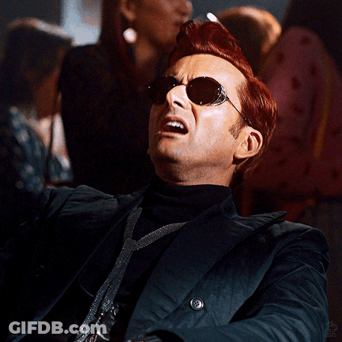 Man In Sunglasses And Black Jacket Looking Up GIF