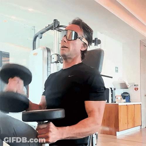 Man In Sunglasses And Black Nike Shirt Lifting Dumbbell GIF