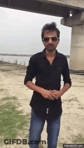 Man In Sunglasses And Black Shirt By Bridge GIF