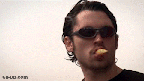 Man In Sunglasses And Black Shirt Eating GIF