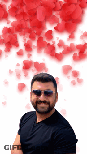 Man In Sunglasses And Black Shirt With Red Hearts GIF