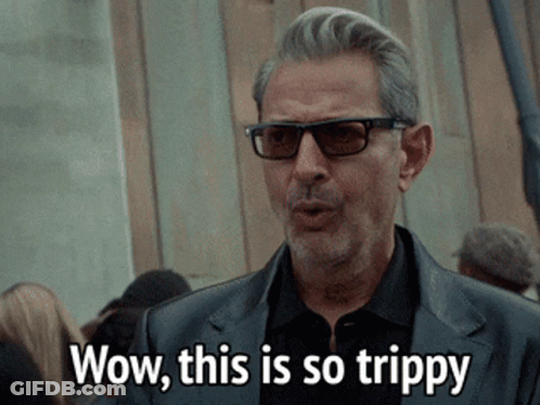 Man In Sunglasses And Black Suit Saying Wow This Is So Trippy GIF