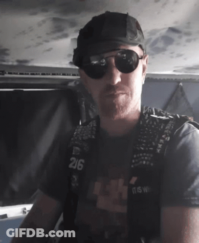 Man In Sunglasses And Black Vest Number 216 GIF