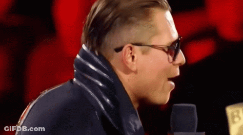 Man In Sunglasses And Blue Jacket At Microphone 13 GIF