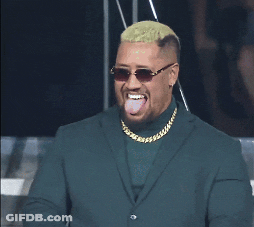 Man In Sunglasses And Blue Jacket Holding Microphone GIF