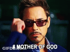 Man In Sunglasses And Blue Jacket Says Mother Of God GIF