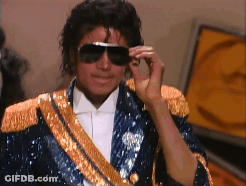 Man In Sunglasses And Blue Jacket With Gold Trim GIF