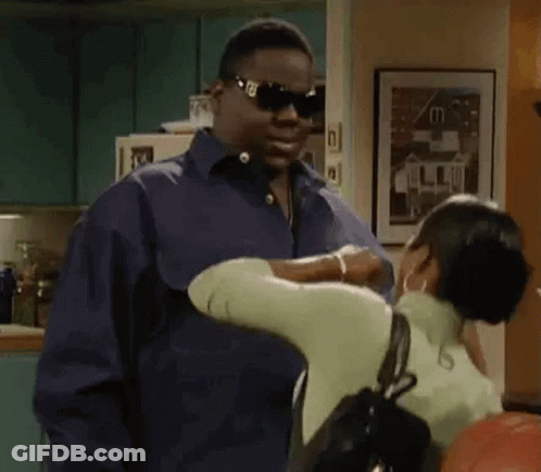 Man In Sunglasses And Blue Shirt Hugging Woman GIF