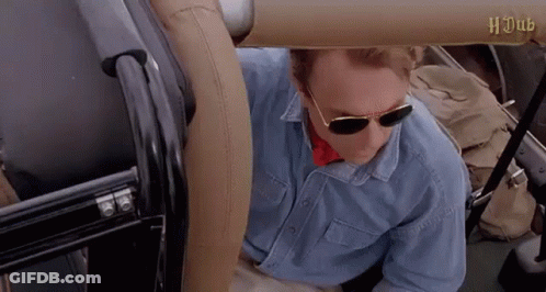 Man In Sunglasses And Blue Shirt Sitting In Back Seat Of Car GIF