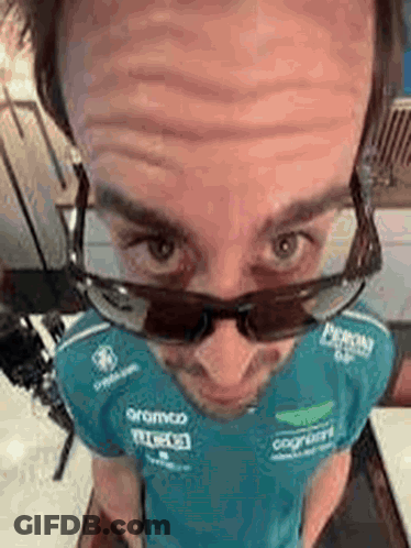 Man In Sunglasses And Blue Shirt Taking Selfie GIF