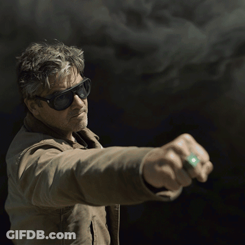 Man In Sunglasses And Brown Jacket Holding Something GIF