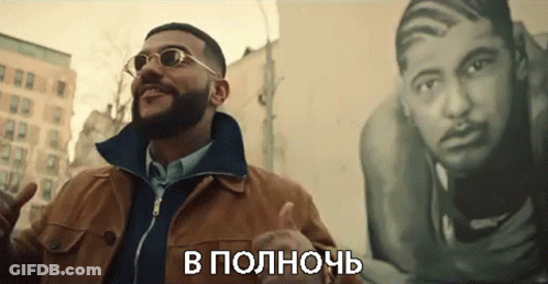 Man In Sunglasses And Brown Jacket In Front Of Painting GIF