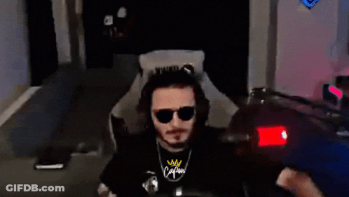 Man In Sunglasses And Calm Shirt Sitting In Chair GIF