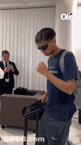 Man In Sunglasses And Champions Shirt GIF