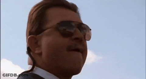 Man In Sunglasses And Earpiece Looking Up GIF