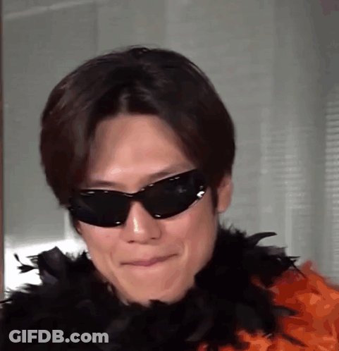 Man In Sunglasses And Feather Boa GIF