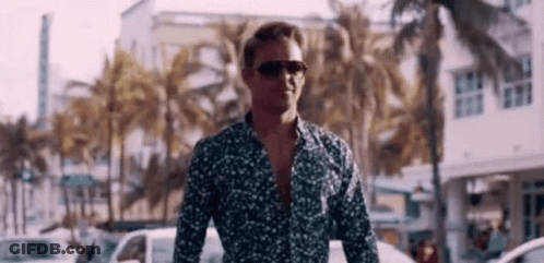 Man In Sunglasses And Floral Shirt Walking GIF