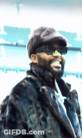 Man In Sunglasses And Fur Coat Smiling GIF