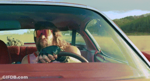 Man In Sunglasses And Gloves Driving Car GIF
