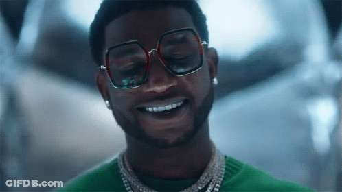 Man In Sunglasses And Green Sweater Smiling GIF