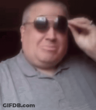 Man In Sunglasses And Grey Shirt GIF