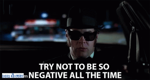 Man In Sunglasses And Hat Driving Saying Try Not To Be So Negative GIF