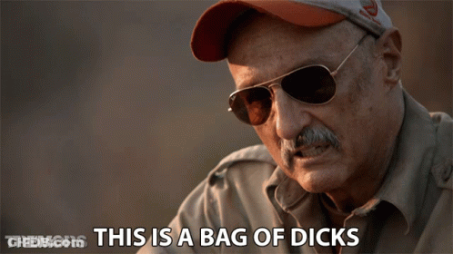 Man In Sunglasses And Hat Saying Tremors This Is A Bag Of Dicks GIF