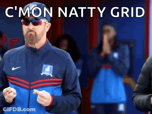 Man In Sunglasses And Hat Standing In Front Of Crowd GIF