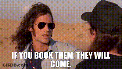 Man In Sunglasses And Hat Talking In Desert GIF
