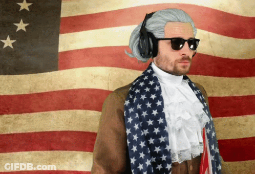 Man In Sunglasses And Headphones In Front Of American Flag GIF