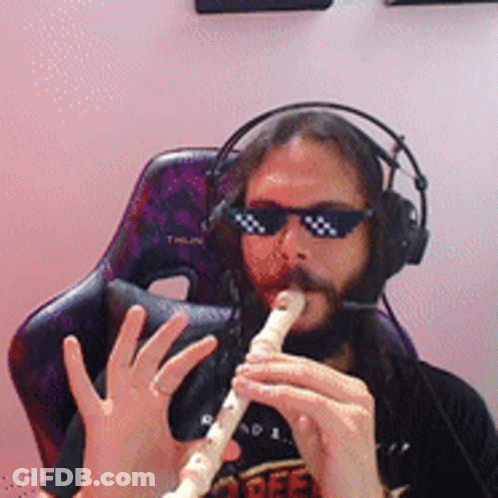 Man In Sunglasses And Headphones Playing Flute GIF
