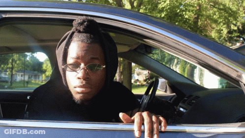 Man In Sunglasses And Hoodie Sitting In Car GIF