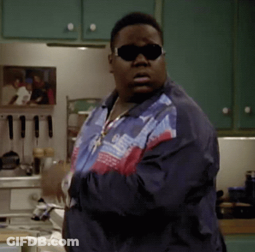Man In Sunglasses And Jacket Standing In Kitchen Arms Crossed GIF