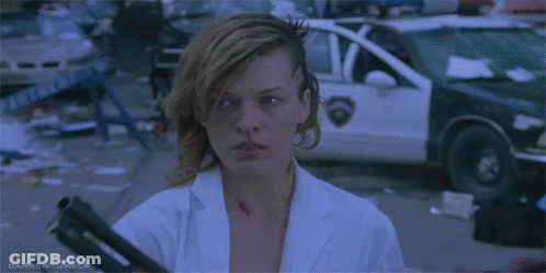 Man In Sunglasses And Leather Gloves Standing In Front Of Woman GIF