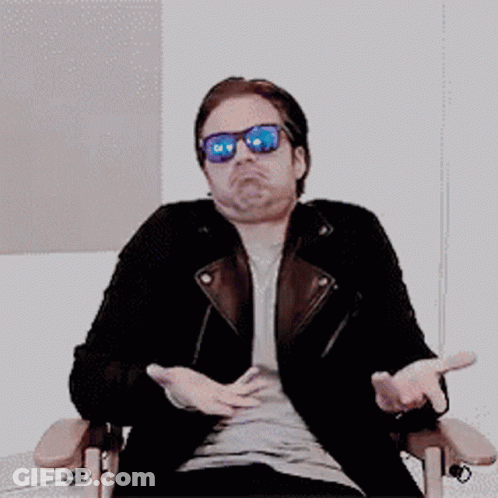 Man In Sunglasses And Leather Jacket Arms Outstretched GIF