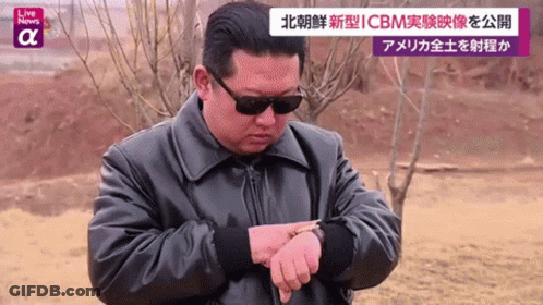 Man In Sunglasses And Leather Jacket Checking Watch GIF