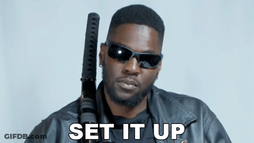 Man In Sunglasses And Leather Jacket Holding Sword Saying Set It Up GIF