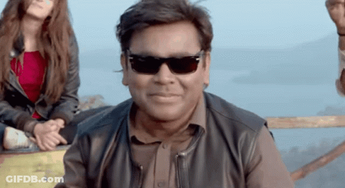 Man In Sunglasses And Leather Jacket Smiling GIF