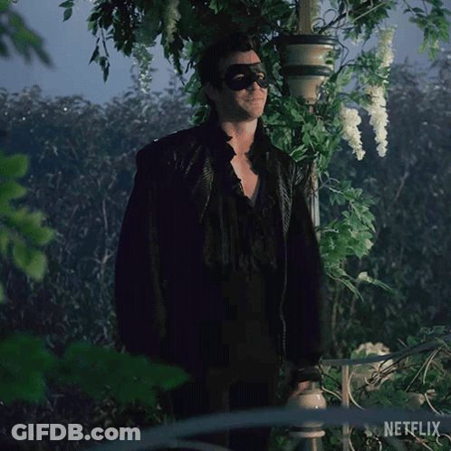 Man In Sunglasses And Mask In Front Of Netflix GIF