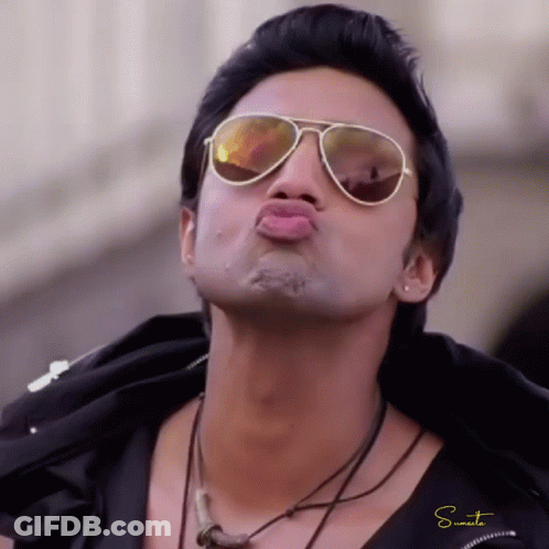 Man In Sunglasses And Necklace Making Kissing Face GIF