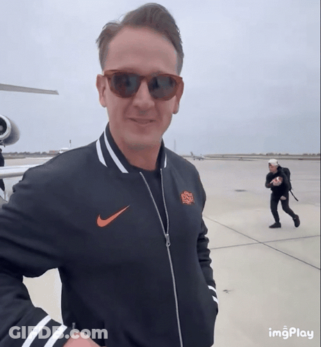 Man In Sunglasses And Nike Jacket Smiling GIF