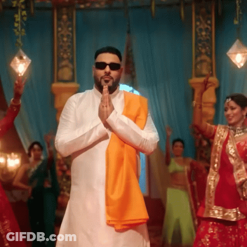 Man In Sunglasses And Orange Scarf Praying Before Women GIF