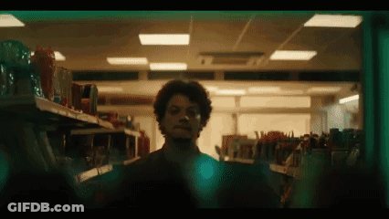 Man In Sunglasses And Orange Sweater Dancing In Front Of Fanta Sign GIF
