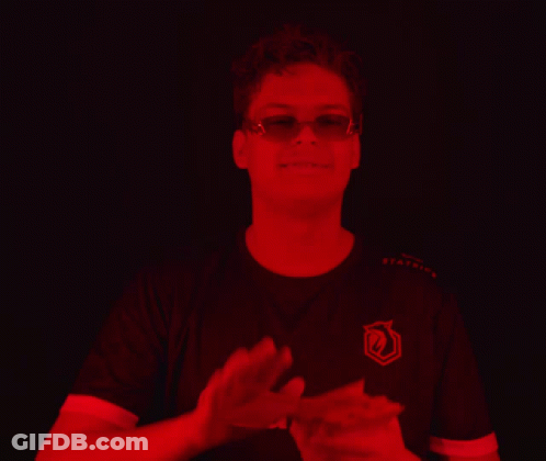 Man In Sunglasses And Orans Applauds Shirt GIF