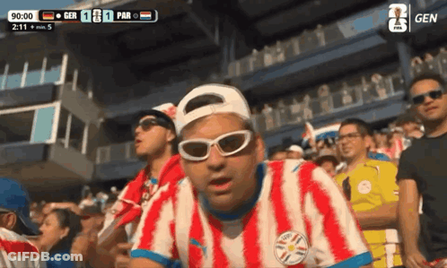 Man In Sunglasses And Paraguay Shirt In Crowd GIF