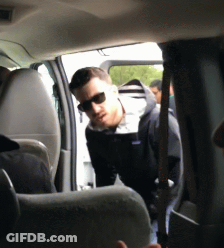 Man In Sunglasses And Patagonia Jacket Standing In Car GIF