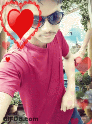 Man In Sunglasses And Pink Shirt Surrounded By Hearts GIF